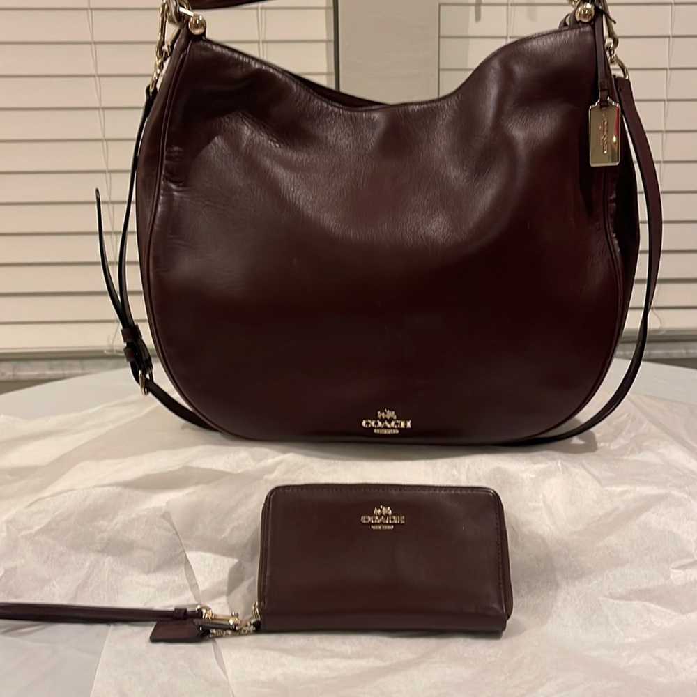 Coach nomad hobo Crossbody bag with matching wallet.
